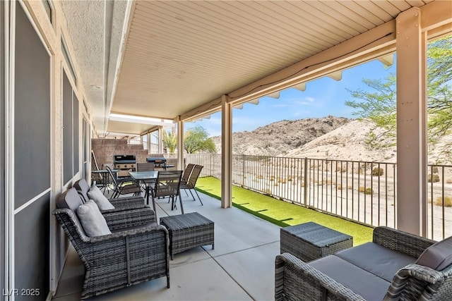 3337 Partridge Run St, Laughlin, NV 89029 - fenced backyard with a mountain view, outdoor dining space, a patio area, and a grill