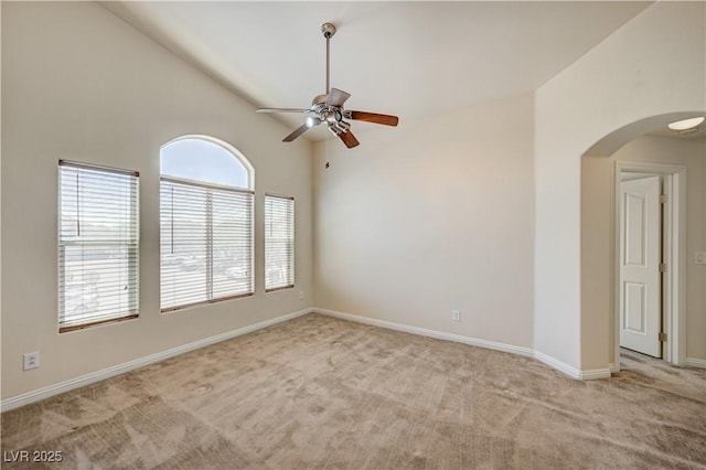 8768 Tom Noon Ave Unit 101, Las Vegas, NV 89178 - unfurnished room with arched walkways, a ceiling fan, light colored carpet, and high vaulted ceiling