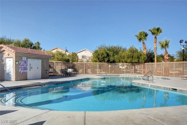 8768 Tom Noon Ave Unit 101, Las Vegas, NV 89178 - community pool with a patio area and an outdoor structure