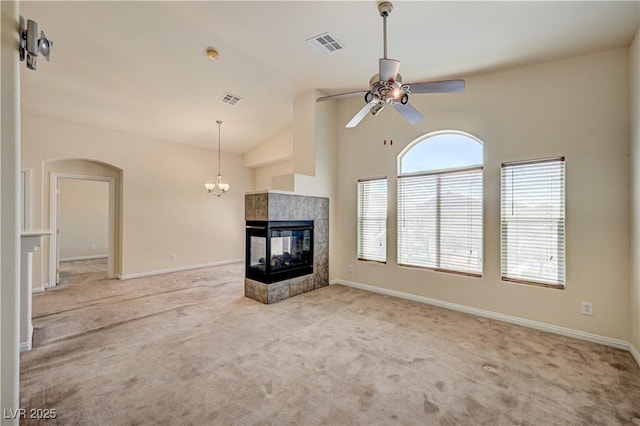 8768 Tom Noon Ave Unit 101, Las Vegas, NV 89178 - unfurnished living room with carpet floors, a ceiling fan, arched walkways, and high vaulted ceiling