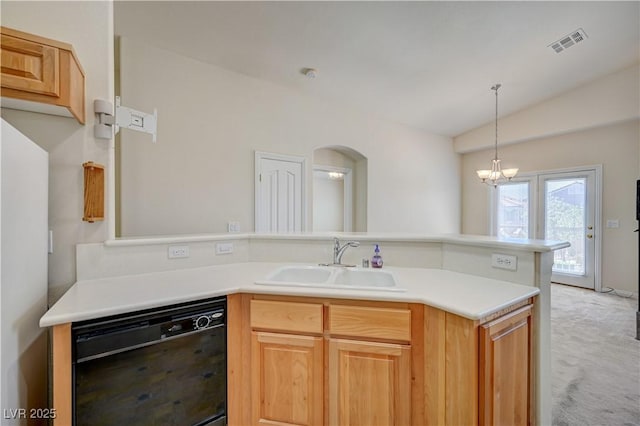 8768 Tom Noon Ave Unit 101, Las Vegas, NV 89178 - kitchen featuring black dishwasher, vaulted ceiling, a peninsula, light countertops, and hanging light fixtures