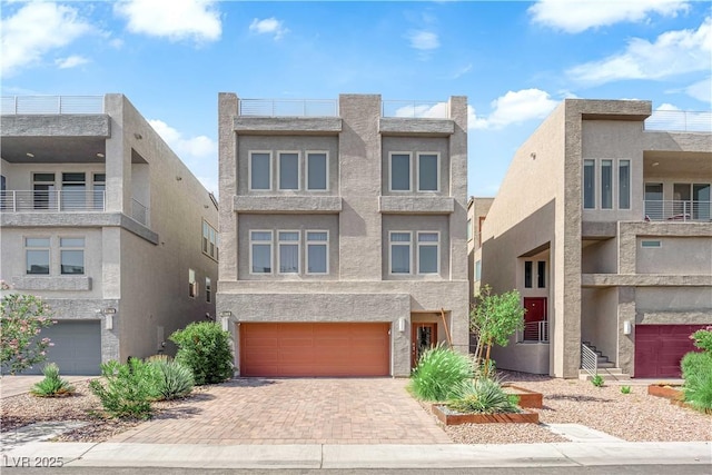 8072 Haywood Estate Ave, Las Vegas, NV 89113 - view of front of house with a garage, decorative driveway, and stucco siding