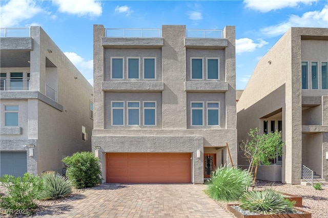 8072 Haywood Estate Ave, Las Vegas, NV 89113 - view of front of house featuring stucco siding, a garage, and decorative driveway