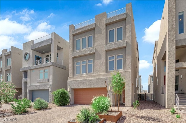 8072 Haywood Estate Ave, Las Vegas, NV 89113 - view of front facade featuring an attached garage, stucco siding, and driveway