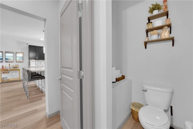 8072 Haywood Estate Ave, Las Vegas, NV 89113 - bathroom featuring wood finished floors and tasteful backsplash
