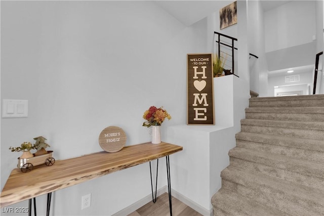 8072 Haywood Estate Ave, Las Vegas, NV 89113 - staircase with wood finished floors and baseboards