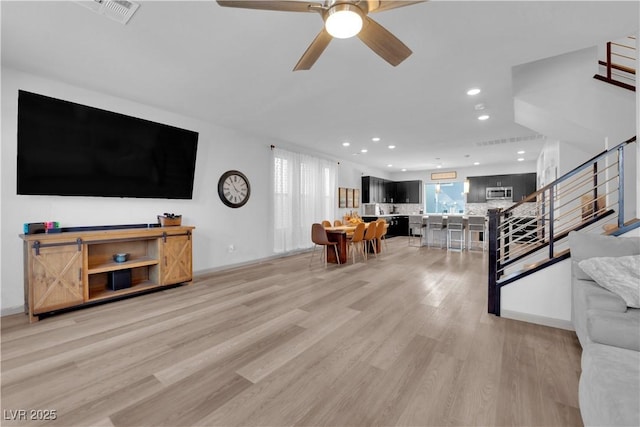 8072 Haywood Estate Ave, Las Vegas, NV 89113 - living room featuring light wood-style floors, recessed lighting, stairs, and ceiling fan
