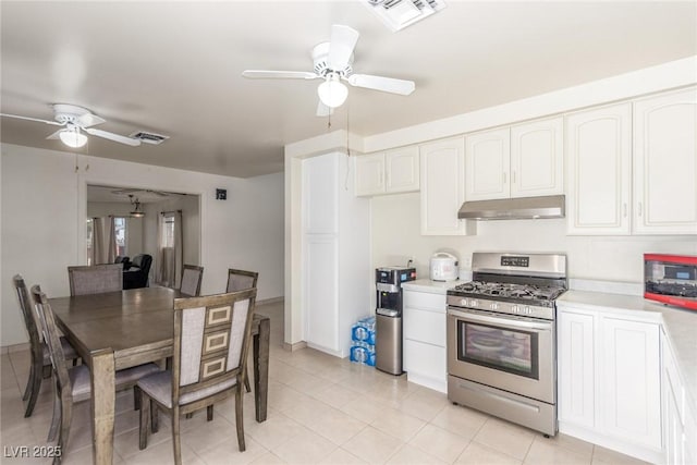 2254 Florence Ave, Las Vegas, NV 89119 - kitchen featuring stainless steel range with gas stovetop, ceiling fan, under cabinet range hood, light countertops, and white cabinetry