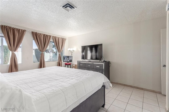 2254 Florence Ave, Las Vegas, NV 89119 - bedroom with a textured ceiling and light tile patterned floors