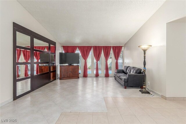 2254 Florence Ave, Las Vegas, NV 89119 - unfurnished living room with lofted ceiling and tile patterned flooring