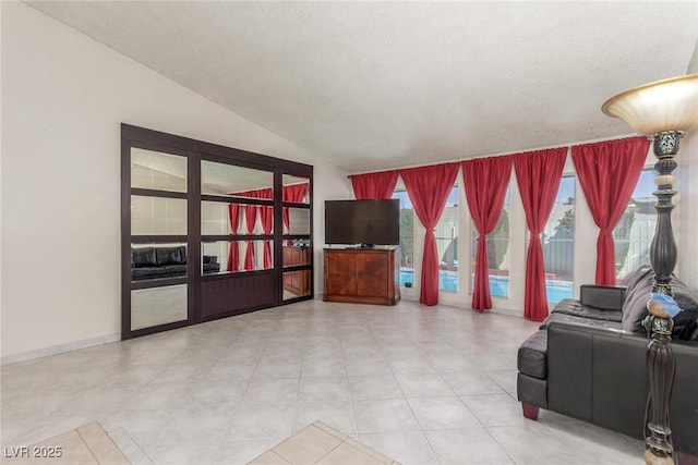2254 Florence Ave, Las Vegas, NV 89119 - living room with lofted ceiling and a textured ceiling