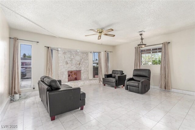 2254 Florence Ave, Las Vegas, NV 89119 - living area with ceiling fan and a textured ceiling