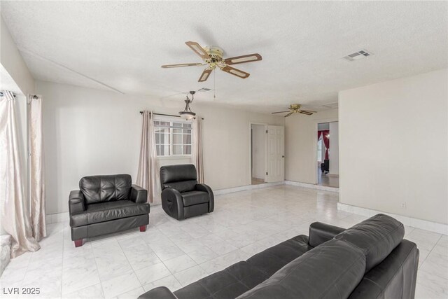 2254 Florence Ave, Las Vegas, NV 89119 - living area with ceiling fan and a textured ceiling