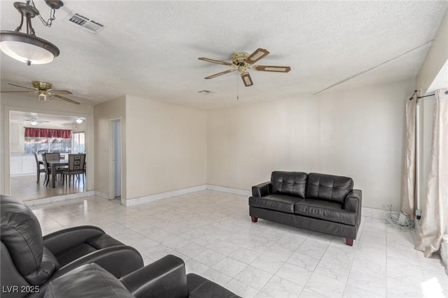 2254 Florence Ave, Las Vegas, NV 89119 - living area with ceiling fan and a textured ceiling