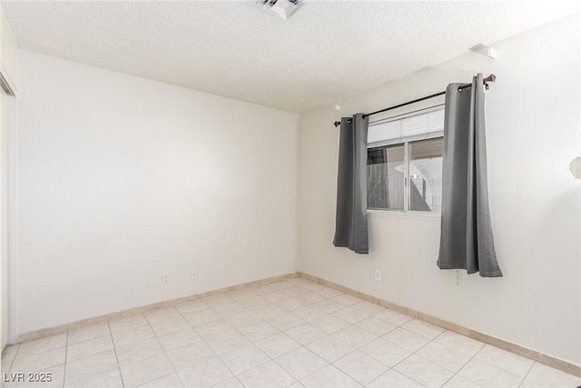 2254 Florence Ave, Las Vegas, NV 89119 - unfurnished room with a textured ceiling and baseboards