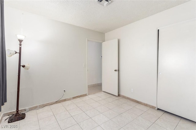 2254 Florence Ave, Las Vegas, NV 89119 - unfurnished bedroom with a textured ceiling and a closet