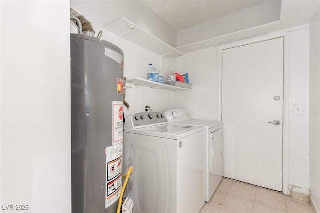 2254 Florence Ave, Las Vegas, NV 89119 - washroom with water heater, washer and dryer, and light tile patterned flooring