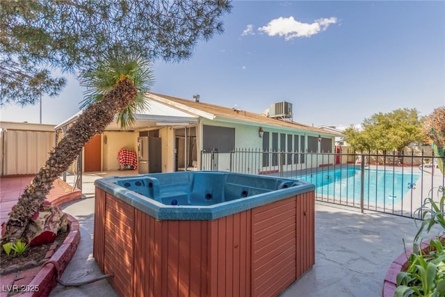 2254 Florence Ave, Las Vegas, NV 89119 - rear view of property featuring a hot tub and a patio area
