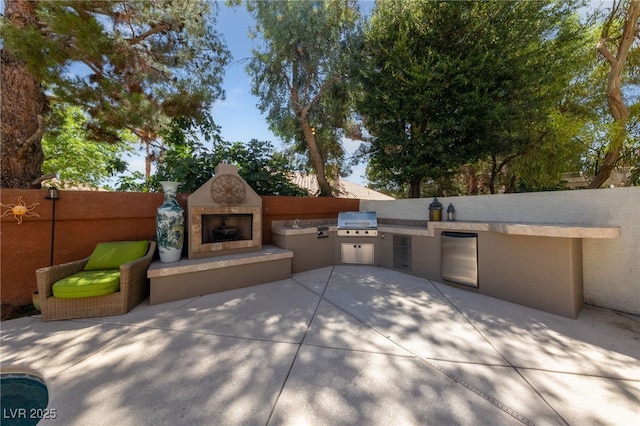5452 Desert Spring Rd, Las Vegas, NV 89149 - view of front facade featuring an outdoor fireplace, an outdoor kitchen, a patio area, and stucco siding