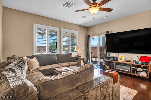 10312 Glimmering Star Dr, Las Vegas, NV 89178 - living area featuring a ceiling fan and dark wood-type flooring