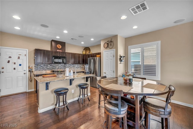 10312 Glimmering Star Dr, Las Vegas, NV 89178 - dining room featuring dark wood-style floors and recessed lighting