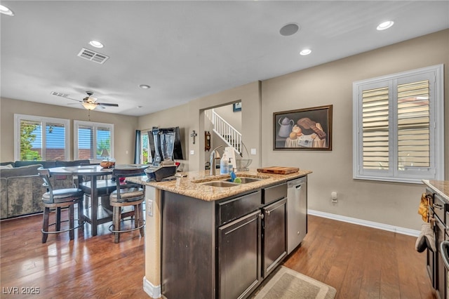 10312 Glimmering Star Dr, Las Vegas, NV 89178 - kitchen with dishwasher, open floor plan, dark wood-style flooring, ceiling fan, and recessed lighting