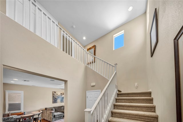 10312 Glimmering Star Dr, Las Vegas, NV 89178 - stairs featuring a high ceiling and recessed lighting