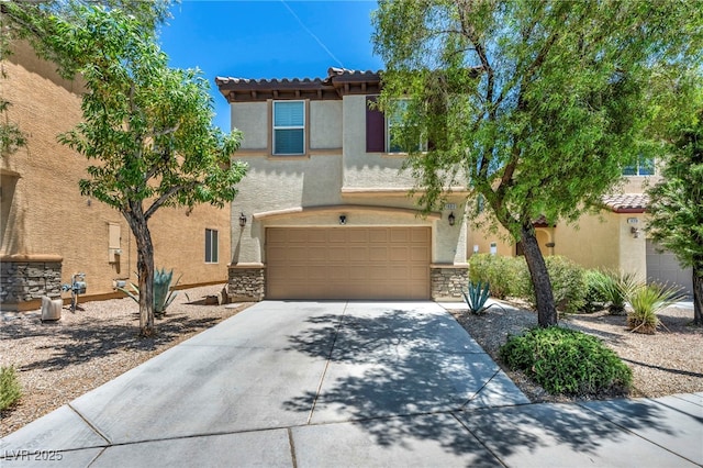 10312 Glimmering Star Dr, Las Vegas, NV 89178 - mediterranean / spanish-style home featuring stucco siding, concrete driveway, stone siding, and a garage