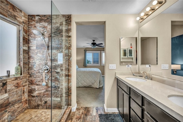 10312 Glimmering Star Dr, Las Vegas, NV 89178 - bathroom with ensuite bath, a tile shower, double vanity, wood finished floors, and a ceiling fan