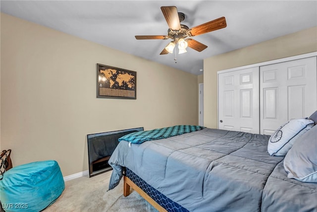 10312 Glimmering Star Dr, Las Vegas, NV 89178 - bedroom featuring light colored carpet, a closet, and a ceiling fan