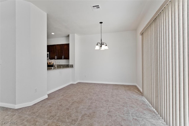 1663 Cloister Ave, Henderson, NV 89014 - unfurnished room with a chandelier and recessed lighting