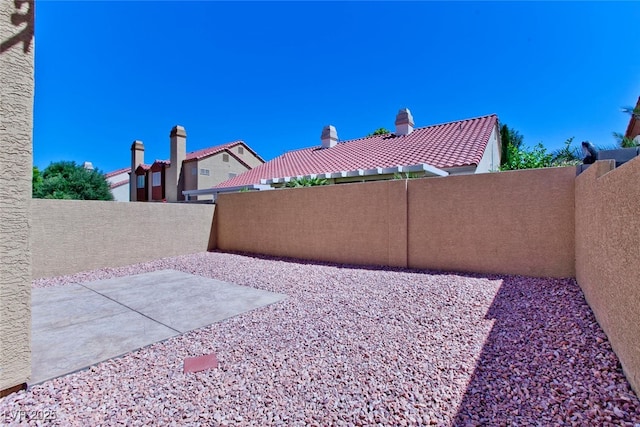 1663 Cloister Ave, Henderson, NV 89014 - fenced backyard featuring a patio area