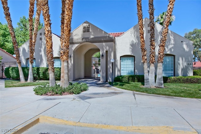 1663 Cloister Ave, Henderson, NV 89014 - view of front of house with stucco siding and a tile roof