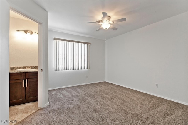 1663 Cloister Ave, Henderson, NV 89014 - spare room featuring a ceiling fan and light colored carpet
