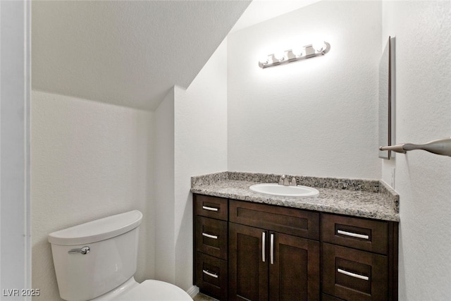 1663 Cloister Ave, Henderson, NV 89014 - half bathroom with vanity and lofted ceiling