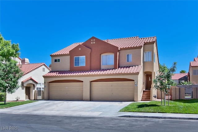 1663 Cloister Ave, Henderson, NV 89014 - mediterranean / spanish-style house featuring stucco siding, concrete driveway, a tile roof, and an attached garage