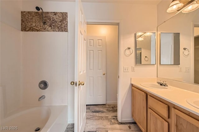 7547 Rolling River Dr, Las Vegas, NV 89131 - bathroom with wood finished floors, double vanity, and tub / shower combination