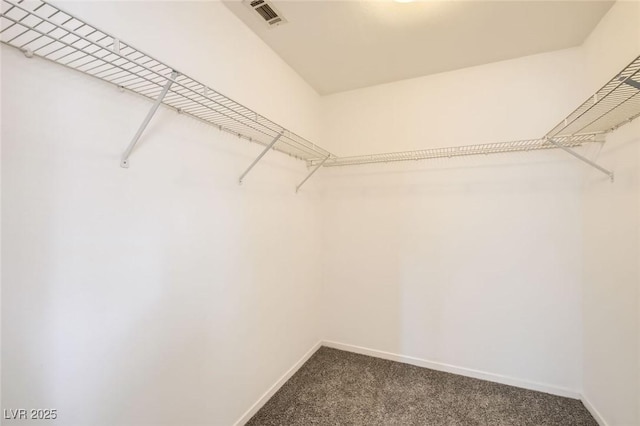 7547 Rolling River Dr, Las Vegas, NV 89131 - spacious closet featuring dark colored carpet