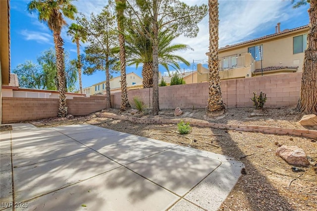 7547 Rolling River Dr, Las Vegas, NV 89131 - fenced backyard featuring a patio area