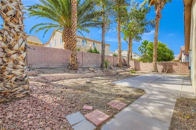 7547 Rolling River Dr, Las Vegas, NV 89131 - fenced backyard with a patio area