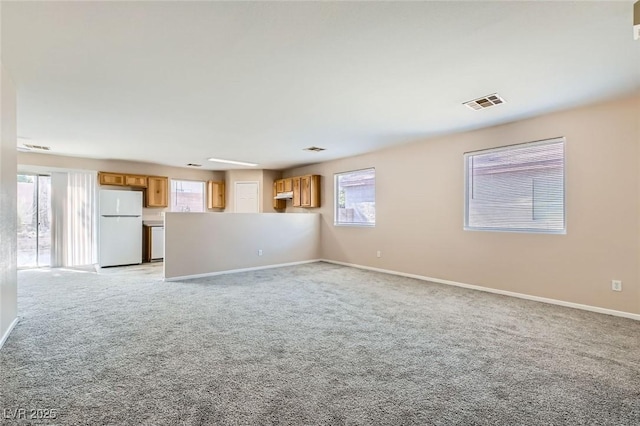 7547 Rolling River Dr, Las Vegas, NV 89131 - unfurnished living room with light colored carpet and plenty of natural light