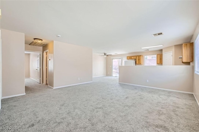 7547 Rolling River Dr, Las Vegas, NV 89131 - unfurnished living room featuring light colored carpet and a ceiling fan