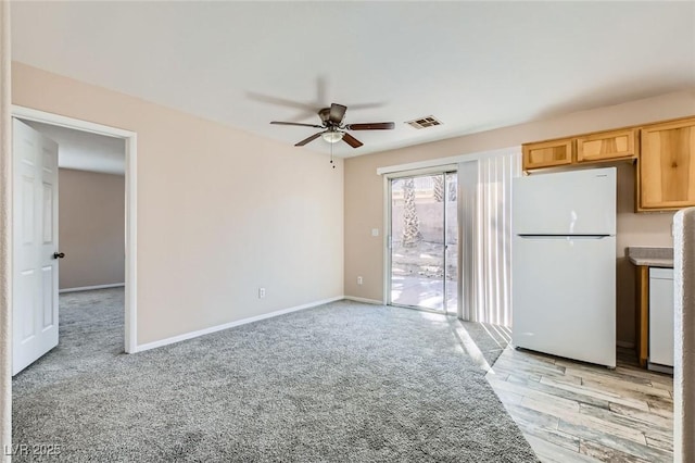 7547 Rolling River Dr, Las Vegas, NV 89131 - unfurnished living room featuring a ceiling fan and light colored carpet