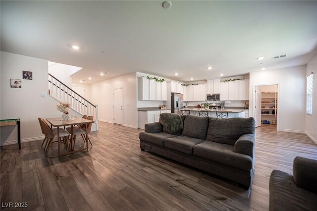 9256 Alden Pointe Ct, Las Vegas, NV 89143 - living area with stairs, dark wood-style floors, and recessed lighting