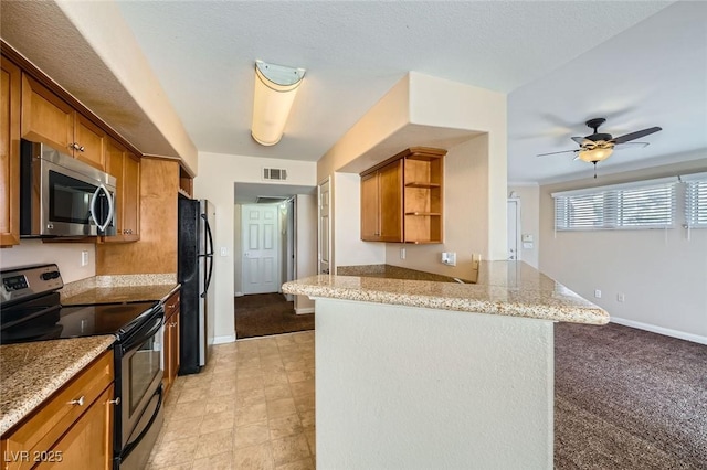 4400 S Jones Blvd Unit 2007, Las Vegas, NV 89103 - kitchen with stainless steel appliances, open shelves, a peninsula, brown cabinetry, and light stone counters