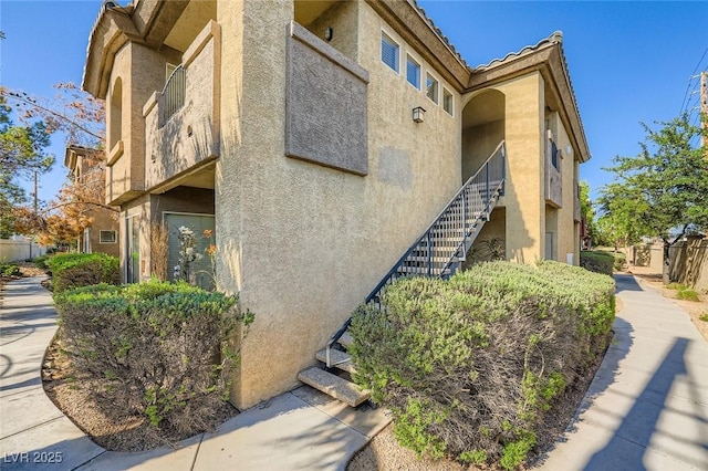 4400 S Jones Blvd Unit 2007, Las Vegas, NV 89103 - view of property exterior featuring stucco siding and stairway