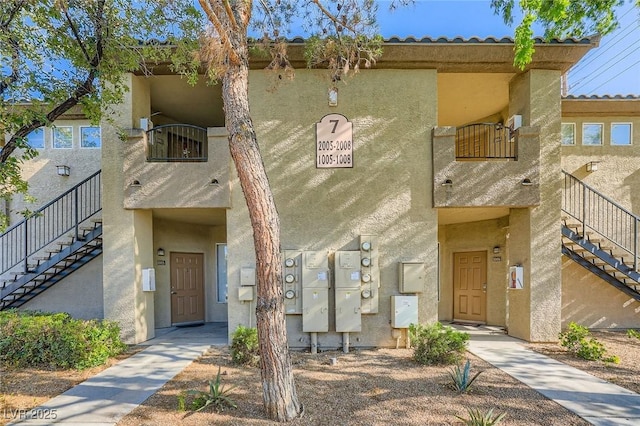 4400 S Jones Blvd Unit 2007, Las Vegas, NV 89103 - townhome / multi-family property featuring stairs and stucco siding