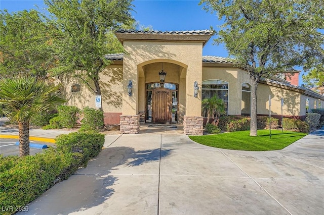 4400 S Jones Blvd Unit 2007, Las Vegas, NV 89103 - doorway to property with a tile roof and stucco siding