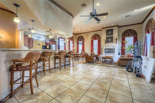 4400 S Jones Blvd Unit 2007, Las Vegas, NV 89103 - kitchen with freestanding refrigerator, ornamental molding, ceiling fan, light tile patterned flooring, and recessed lighting