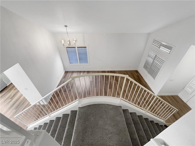 6696 Merced Lake Dr, Las Vegas, NV 89156 - stairs with a chandelier and wood finished floors